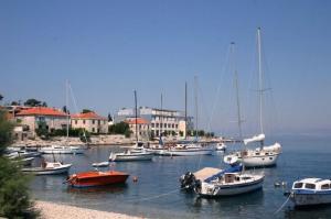 a bunch of boats are docked in a harbor at Apartments Jelka in Postira +17 photos