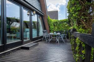 Μπαλκόνι ή βεράντα στο Ferienhaus Küstenkind - Top Lage - Garten eingezäunt