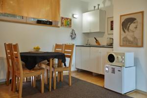 a kitchen and dining room with a table and chairs at Villa In Bio Garden - You Will Save Money Here in Prague