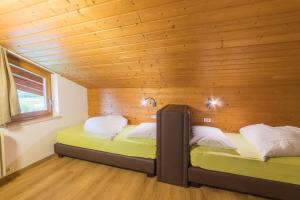 Postel nebo postele na pokoji v ubytování Pension Apartments Pardell
