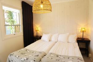 Ένα ή περισσότερα κρεβάτια σε δωμάτιο στο Visby Gustavsvik
