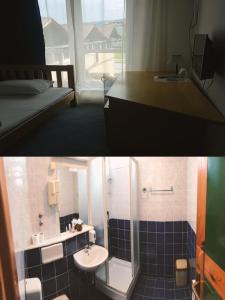 y baño con lavabo, aseo y espejo. en Hotel Imzit Dobrinja en Sarajevo