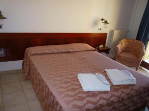 Postel nebo postele na pokoji v ubytování Hotel L'Ancora