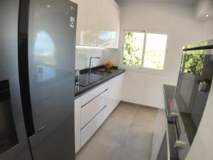 Kuchyňa alebo kuchynka v ubytovaní Villa Rafaela