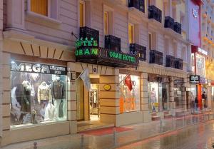 a store on a city street at night at Oran Hotel in Istanbul
