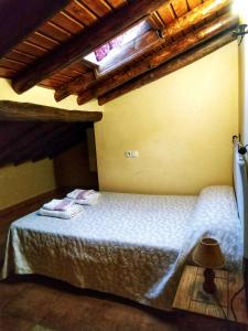 En eller flere senge i et værelse på Casa rural La Villa