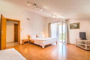 Posteľ alebo postele v izbe v ubytovaní Apartment AnaKatarina