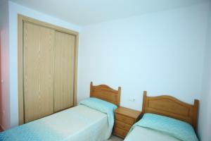 Postel nebo postele na pokoji v ubytování Apartamento oroblanc