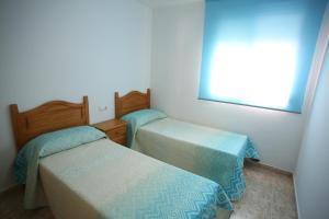 Postel nebo postele na pokoji v ubytování Apartamento oroblanc + 18 fotografií