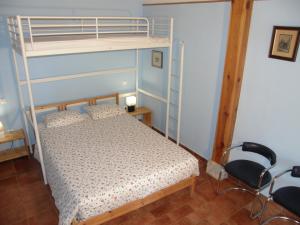 Postel nebo postele na pokoji v ubytování Albergue San Bruno