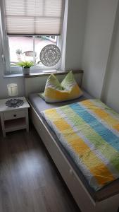 Postel nebo postele na pokoji v ubytování Café Hausnordlicht 3