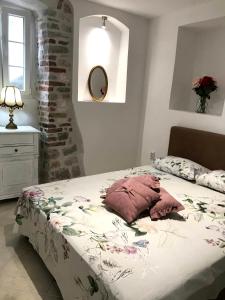 a bedroom with a bed and a mirror on the wall at New renovated Old Town Martiva Apartment in Kotor