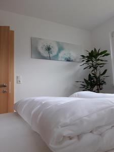 Кровать или кровати в номере Appartement PIA