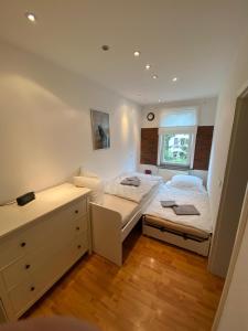 a bedroom with two beds and a window at Apartment Ferienwohnung Blumenstadt in Erfurt