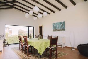 a dining room with a table and chairs at Panoramic Beachfront Villa - Direct Beach Access in Esposende