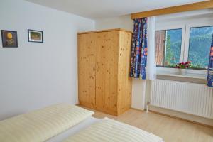 Łóżko lub łóżka w pokoju w obiekcie Apartments Kirchebnerhof