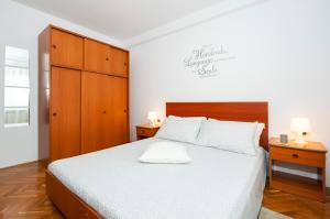 Postel nebo postele na pokoji v ubytování Apartments Anamarija