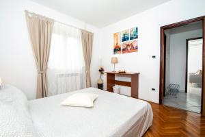 Postel nebo postele na pokoji v ubytování Apartments Anamarija