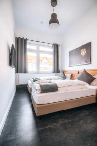 a row of beds in a room at Sleep Point in Bremen