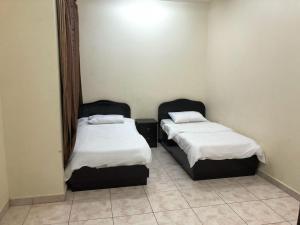 Säng eller sängar i ett rum på Al Awael Furnished Units
