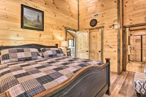 A bed or beds in a room at Modern Gatlinburg Cabin with Hot Tub, Game Room