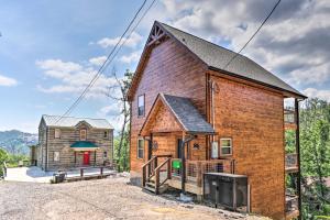 a home in the woods with a barn at Hot Tub, Game Room, Decks Cabin in Gatlinburg in Gatlinburg