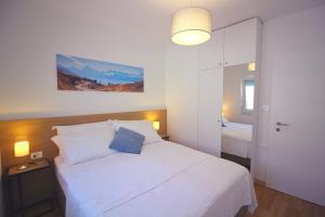 Postel nebo postele na pokoji v ubytování Sun Apartments