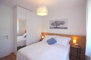 Postel nebo postele na pokoji v ubytování Sun Apartments