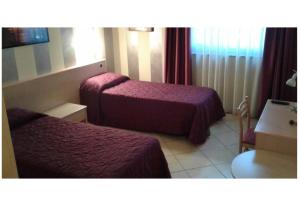 Кровать или кровати в номере Mini Hotel