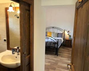Postel nebo postele na pokoji v ubytování B&B Mandorla Amara