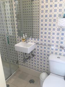 a bathroom with a sink and a toilet at 3 Bedroom Town House - Historic Centre of Cascais. 100 mts from the beach and centre of Cascais in Cascais