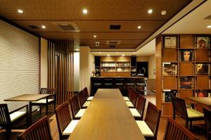 a restaurant with tables and chairs and a bar at Ochanomizu Hotel Shoryukan in Tokyo