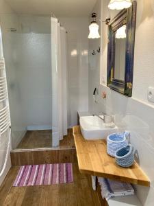 a white bathroom with a sink and a shower at Chalupa Spoko Liptov in Trstené +51 photos