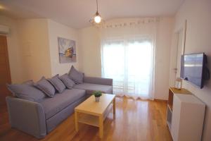 TV a/nebo společenská místnost v ubytování Sun Apartments