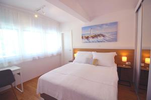 Postel nebo postele na pokoji v ubytování Sun Apartments