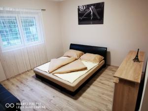 Postel nebo postele na pokoji v ubytování Renáta Apartman