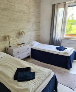 Säng eller sängar i ett rum på Saltvik Bed & Breakfast