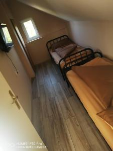Posteľ alebo postele v izbe v ubytovaní Renáta Apartman