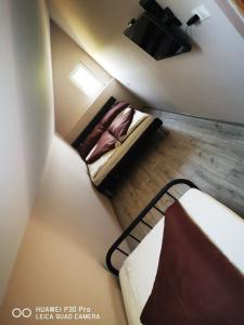Posteľ alebo postele v izbe v ubytovaní Renáta Apartman