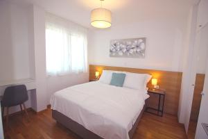 Postel nebo postele na pokoji v ubytování Sun Apartments