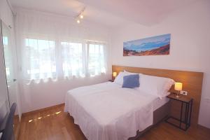 Postel nebo postele na pokoji v ubytování Sun Apartments