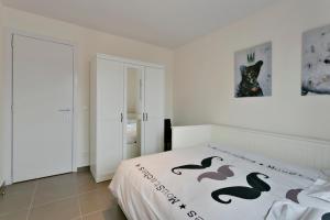 Krevet ili kreveti u jedinici u okviru objekta Lichtrijk appartement Oostende