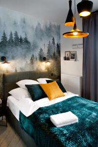 מיטה או מיטות בחדר ב-Prymasa Tysiaclecia - P&O Serviced Apartments