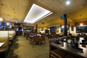a restaurant dining room with tables and chairs at Victoria Inn Hotel & Convention Centre Brandon in Brandon