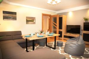 Televízia a/alebo spoločenská miestnosť v ubytovaní Apartament Panorama 2 18