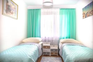 Posteľ alebo postele v izbe v ubytovaní Apartament Panorama 2 18