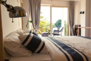 Postel nebo postele na pokoji v ubytování Villa Mediterranea - Apartments