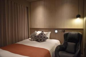 Letto o letti in una camera di Hotel Grand View Takasaki