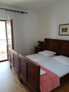 Postel nebo postele na pokoji v ubytování Apartments Alexa