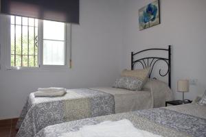 Postel nebo postele na pokoji v ubytování BAMBÚ · Casa rural en Vejer con piscina privada + 15 fotografií